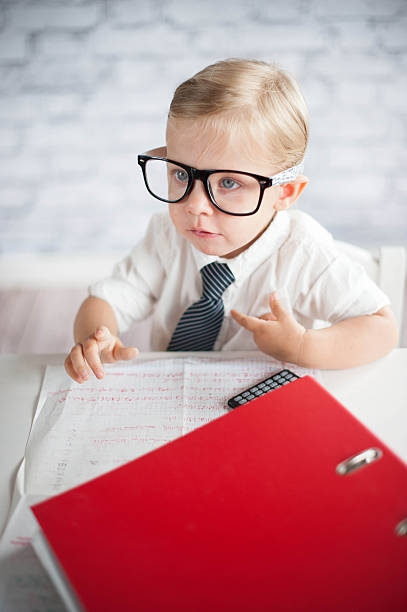 istock Little business person eating chocolate at work 530339865
