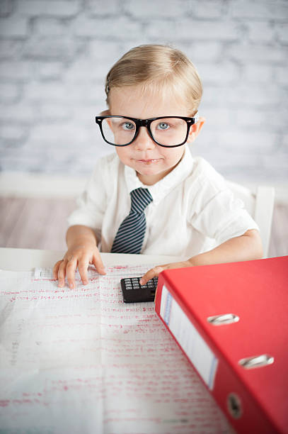 istock Little business person eating chocolate at work 530339869