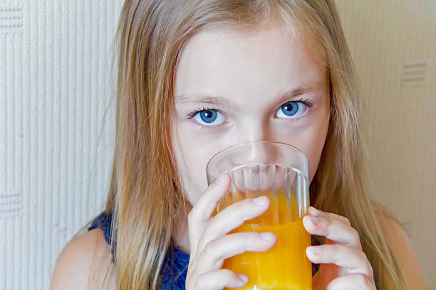 istock Cute girl drinking beverage 530340031