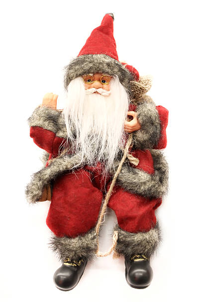 istock Santa Claus doll sits with a sack on white background. 530340819