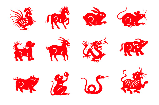 Red handmade cut paper chinese zodiac animals isolated on white background