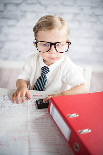 istock Little business person eating chocolate at work 530353263