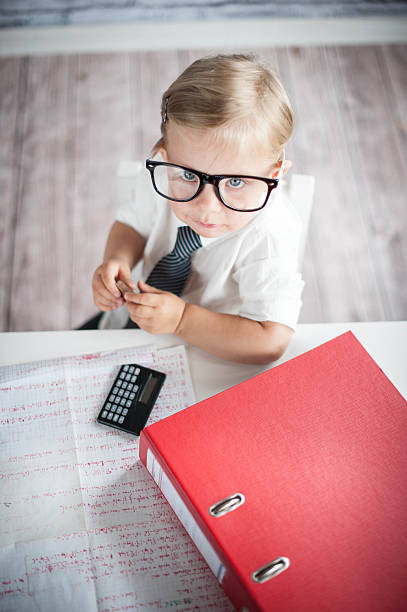 istock Little business person eating chocolate at work 530353267