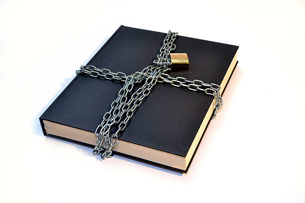 istock black book with chain and padlock 530362371