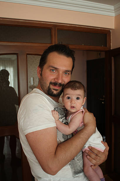istock father and baby daughter 530364859