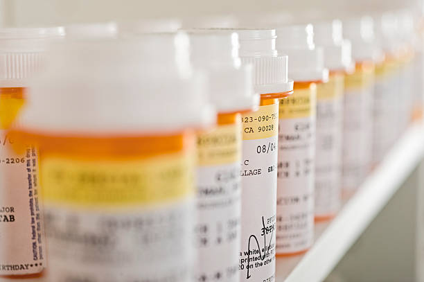 Medicine Bottles Arranged In Shelf
