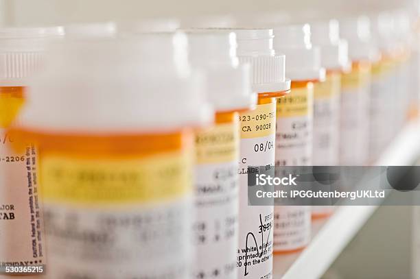 Medicine Bottles Arranged In Shelf Stock Photo - Download Image Now - Medicine, Bottle, Label