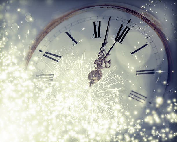 istock Vintageclock with fireworks and holiday lights 530365301