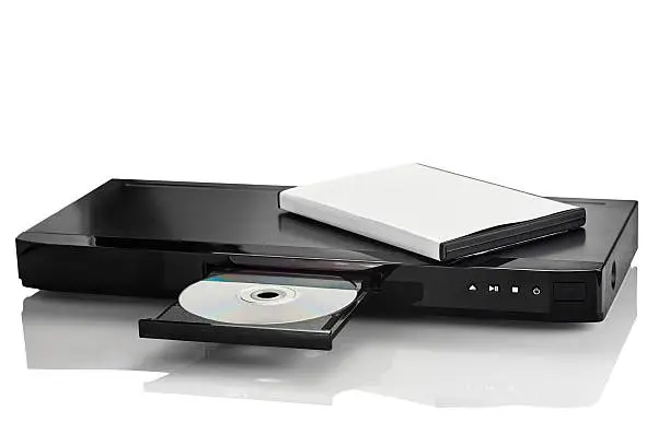 Blue Ray player with a disk on a white background closeup