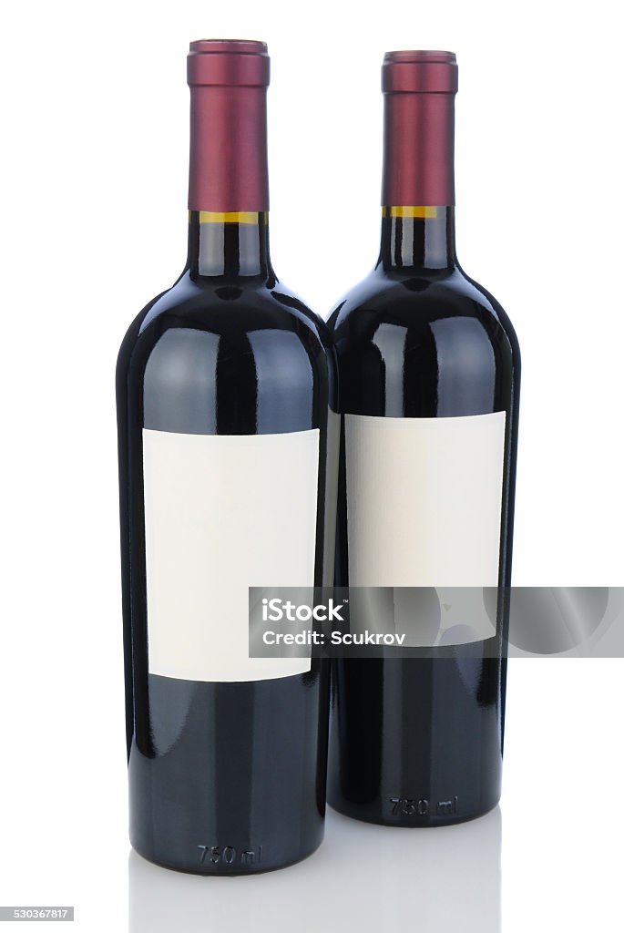 Two Cabernet Bottles with Blank Labels Two cabernet sauvignon bottles on white with reflection. Bottles have blank labels ready for your design or copy. Cabernet Sauvignon Grape Stock Photo