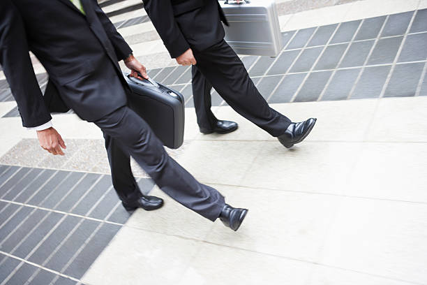 istock business partners walking together 530368333