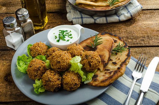 Health crunchy falafel with mint and garlic dip, naan bread with cumin and herbsHealth crunchy falafel with mint and garlic dip, naan bread with cumin and herbs