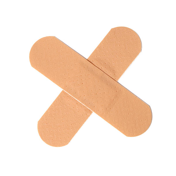Cross bandaid Cross bandaid harm stock pictures, royalty-free photos & images