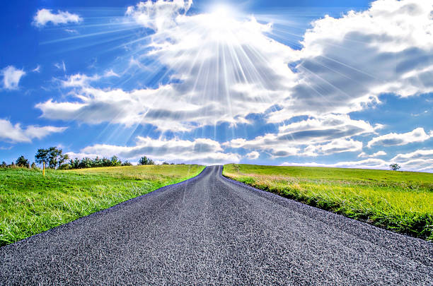 istock Country Road leading to a blue sky 530380791