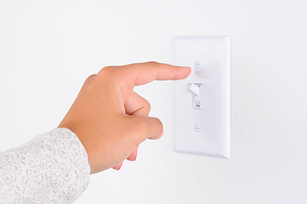 istock Woman Turning Out the Lights 530380799