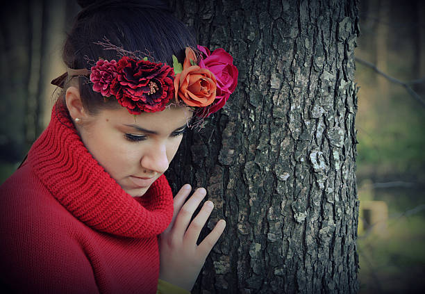 istock Pensive young woman by the tree 530382177