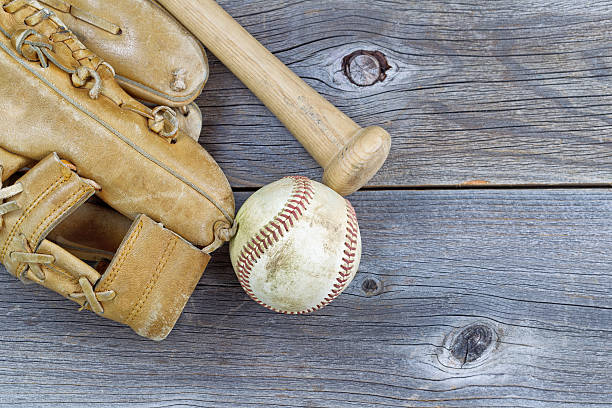 istock Old Baseball equipment on Aged Wood 530383693