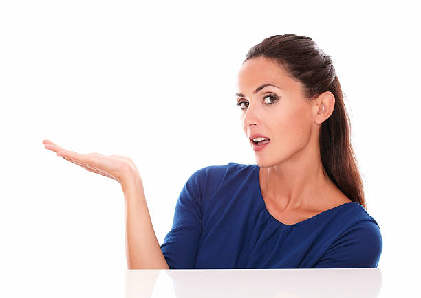 istock Attractive lady in blue shirt with palm up 530388849