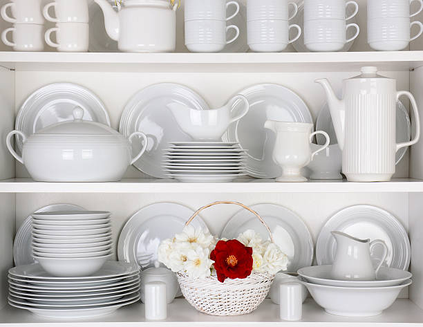 istock White Plates in Cupboard With a Basket of Roses 530389059