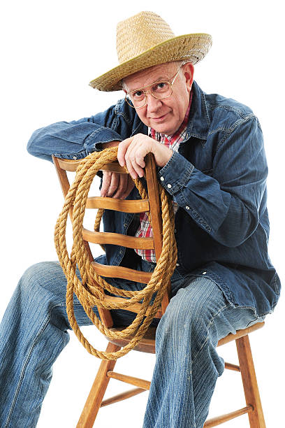istock Sitting Senior Cowboy 530389861