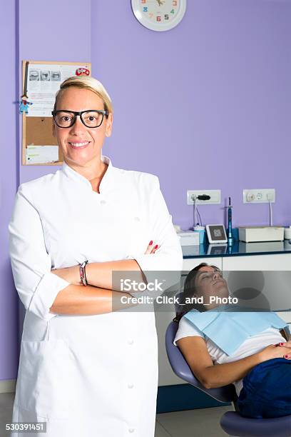 Female Dentist And A Patient Stock Photo - Download Image Now - Adult, Adults Only, Cabinet