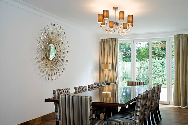 istock Chandelier Over Dining Table And Art On Wall 530393291