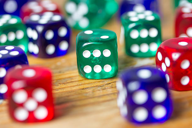 istock colorful dices background on wood 530393573