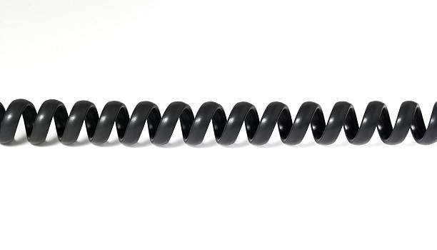 istock Twisted black telephone cord 530393811