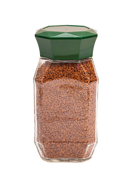 istock Jar of coffee isolated on white 530395469