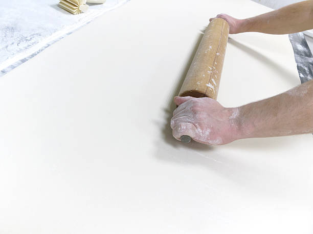 istock Preparation of dough with rolling pin in a  bakery 530395725