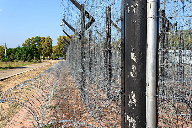 istock Straight prison fence 530395839