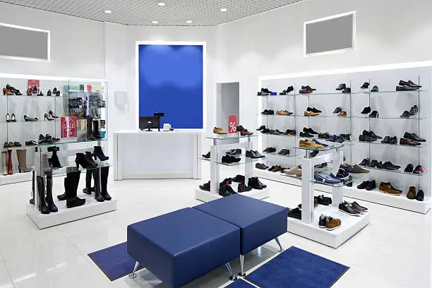 Photo of interior of shoe store in modern european mall