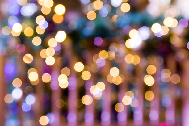 Festive New Year's background with Fabulous Christmas bokeh of colored lights, decorative elements, and snowflakes. Christmas card