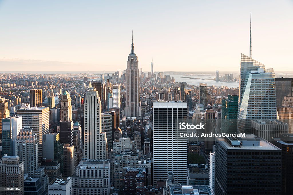 Empire State and New York skyline Aerial view of the Empire State Building and downtown Manhattan on a clear day at dusk, New York City.  Aerial View Stock Photo