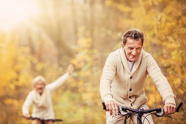 istock Active seniors riding bike and having fun 530403857