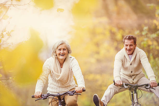 istock Active seniors riding bike and having fun 530403863