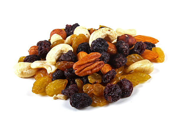 istock mixed nuts and raisins isolated on white 530403999
