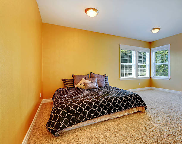 istock Bedroom interior in bright yellow color 530405507