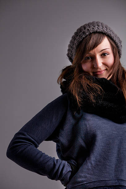 istock winter dressed pretty woman smiling 530405877