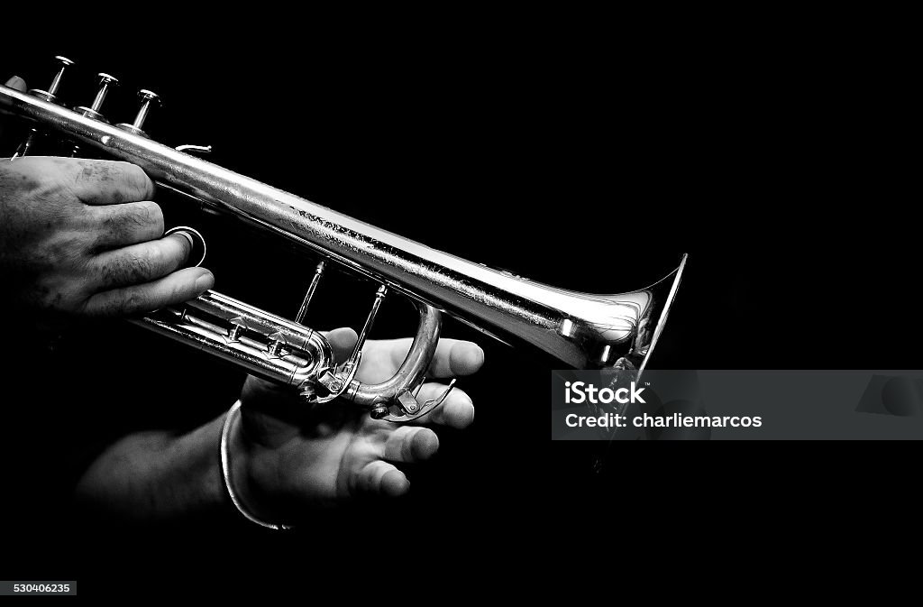hands of musician trumpeter playing his trumpet in black and white Jazz Music Stock Photo