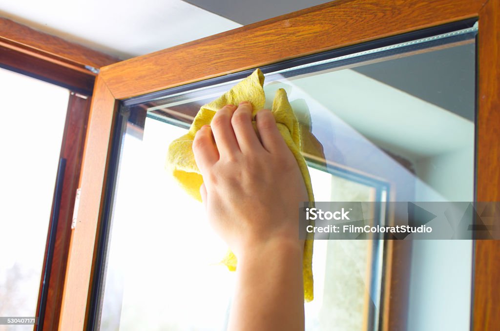 Cleaning. Window cleaning close up. Adult Stock Photo