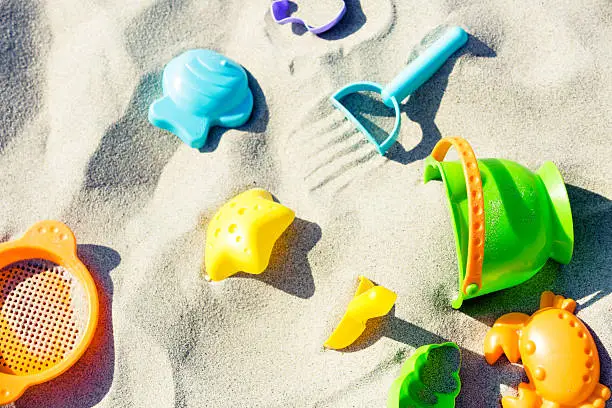 Colorful baby sand toys on the beach