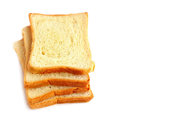 fatias de pão branco num fundo branco - undernourishment imagens e fotografias de stock