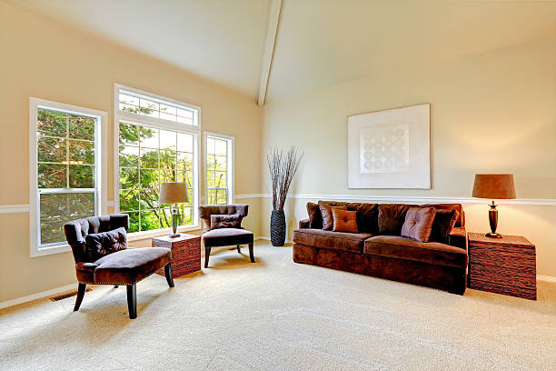 istock Bright ivory living room with high vaulted ceiling 530411129