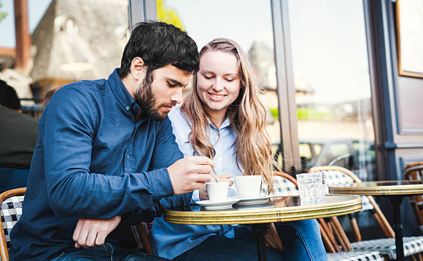 istock Young Couple Drinking Coffee in a Sidewalk Cafeteria 530411326