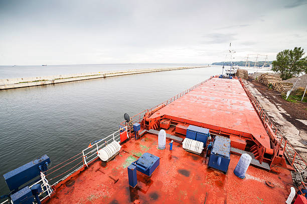 istock Deck of cargo ship moored in a harbor 530411683