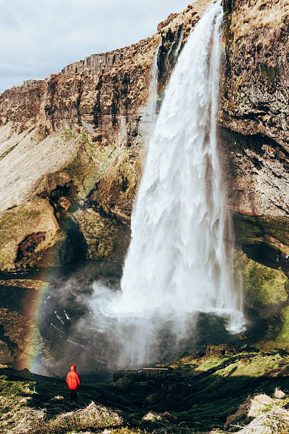 istock Man near the waterfall 530411942