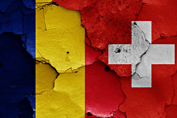 istock flags of Romania and Switzerland painted on cracked wall 530412372