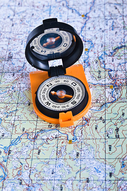 istock The magnetic compass and topographic map. 530413038