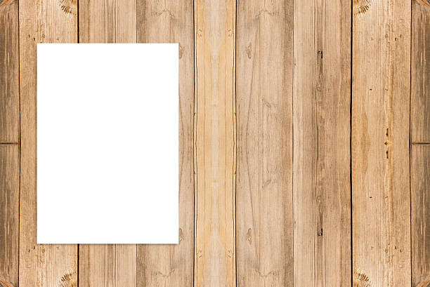 istock Blank folded paper poster hanging on wooden wall, 530413160